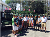 High School Boy's Baseball Team in front of a decorated truck